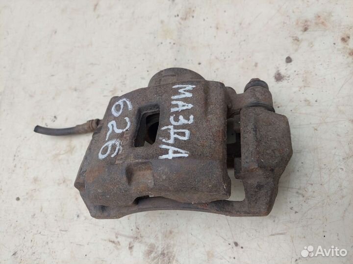 Суппорт передний правый на mazda 626