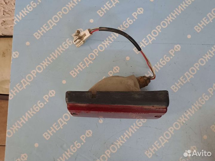 Фонарь противотуманный задний Land Cruiser 80