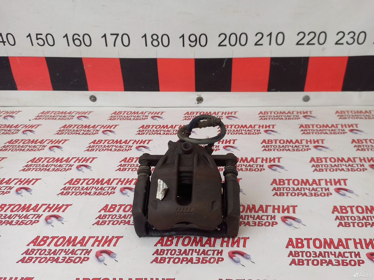 Супорт тормозной передний левый Ниссан Алмера G15