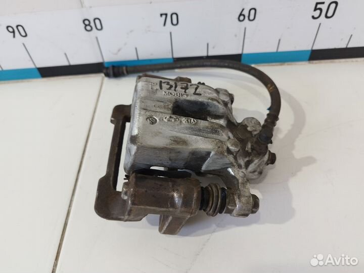 Суппорт тормозной задний правый ix35/Tucson 2010