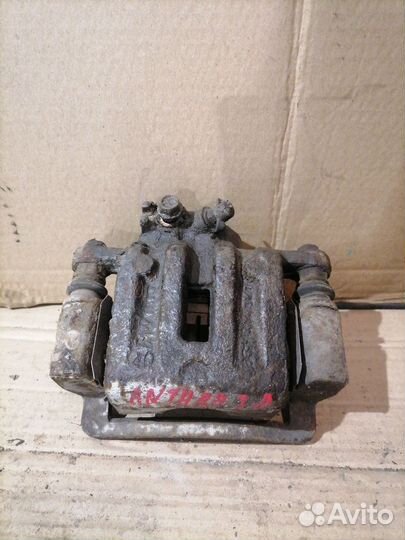 Суппорт тормозной задний левый Opel Antara