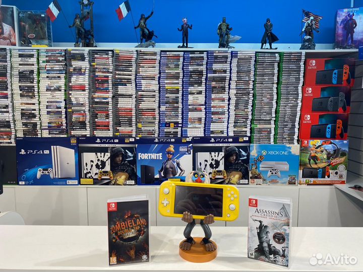 Nintendo Switch Lite + Zombieland + Assasins Creed