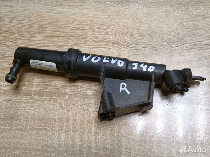 Форсунка омывателя фар левая Volvo S40