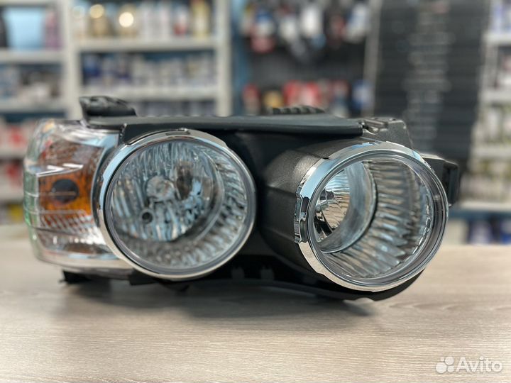 Фара левая Chevrolet Aveo т300 хром.обод эл.коррек