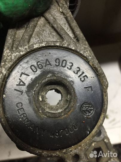 06A903315F Натяжитель ремня VAG