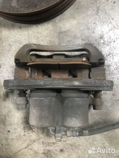 Суппорт тормозной передний левый Mazda Cx7 EH 2.5