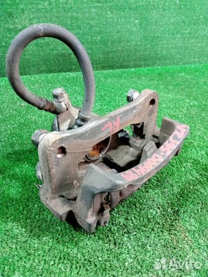 Суппорт тормозной задний левый Toyota Land Cruiser