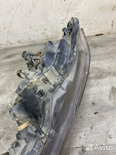 Фара левая Mitsubishi Lancer