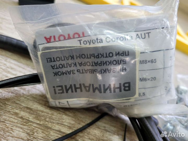 Блокиратор капота и кпп Toyota Corolla E140