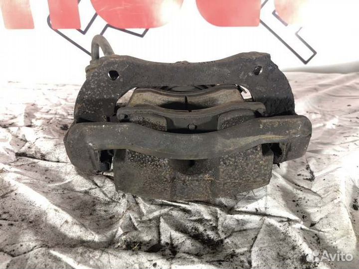 Суппорт тормозной передний левый Opel Astra J До