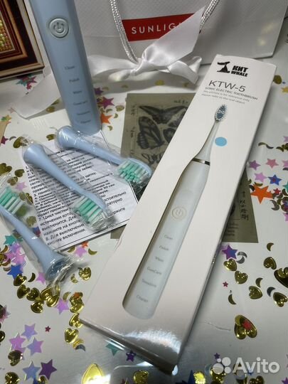 Электрическая зубная щетка