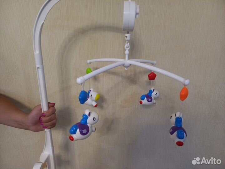 Музыкальная карусель с заводным механизмом