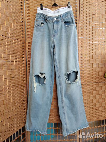 Джинсы женские с разрезами под попой