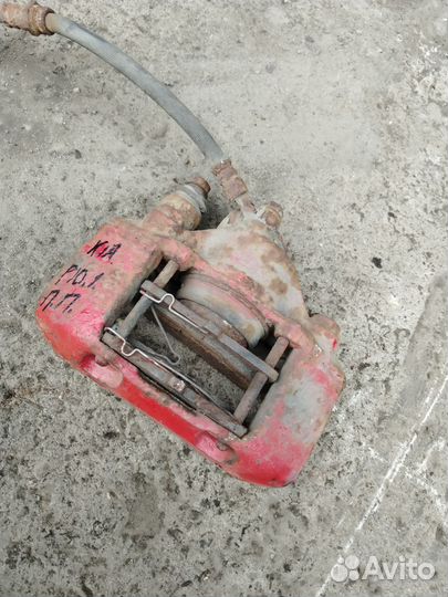 Суппорт тормозной передний правый Kia Pio 1