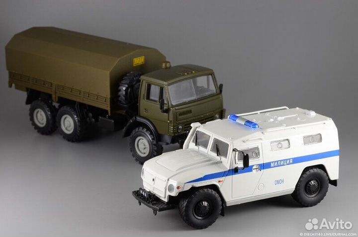 Модель автомобиля Газ Тигр Омон милиция 1:43