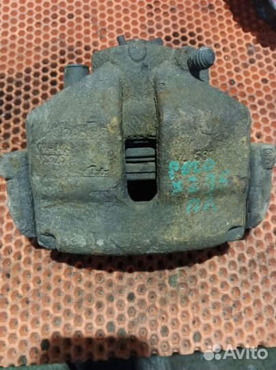 Суппорт тормозной передний левый Volkswagen Polo