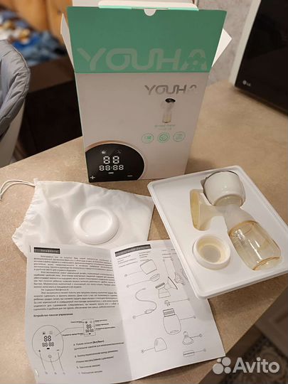 Молокоотсос электрический новый