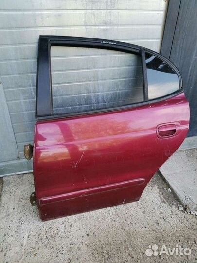 Дверь задняя левая со стеклом (Daewoo Leganza)