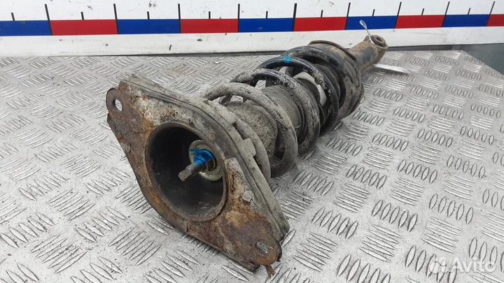 Стойка амортизатора заднего левого Nissan Almera