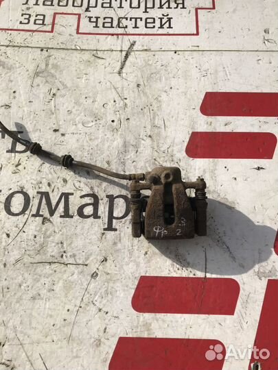 Суппорт тормозной задний левый Land Rover Freeland