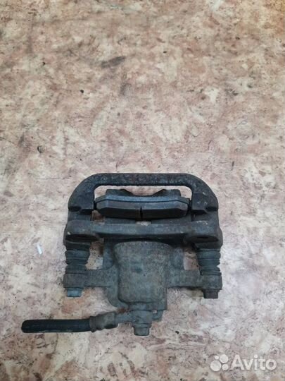 Суппорт тормозной задний левый Chevrolet Lacetti