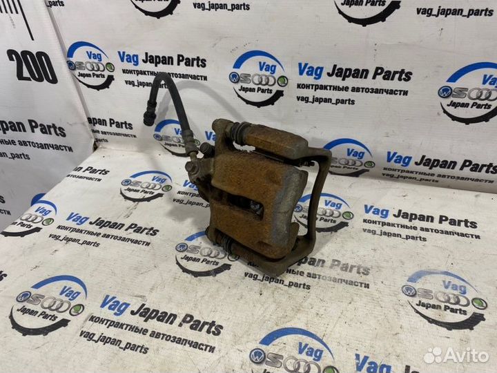 Суппорт тормозной задний левый Volkswagen Tiguan