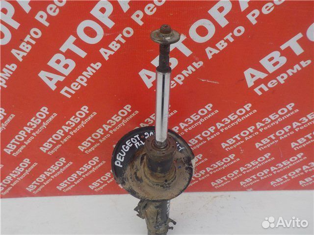 Амортизатор передний левый Peugeot 207 2006-2013