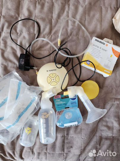 Молокоотсос medela swing