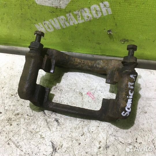 Скоба суппорта переднего Рено Сценик