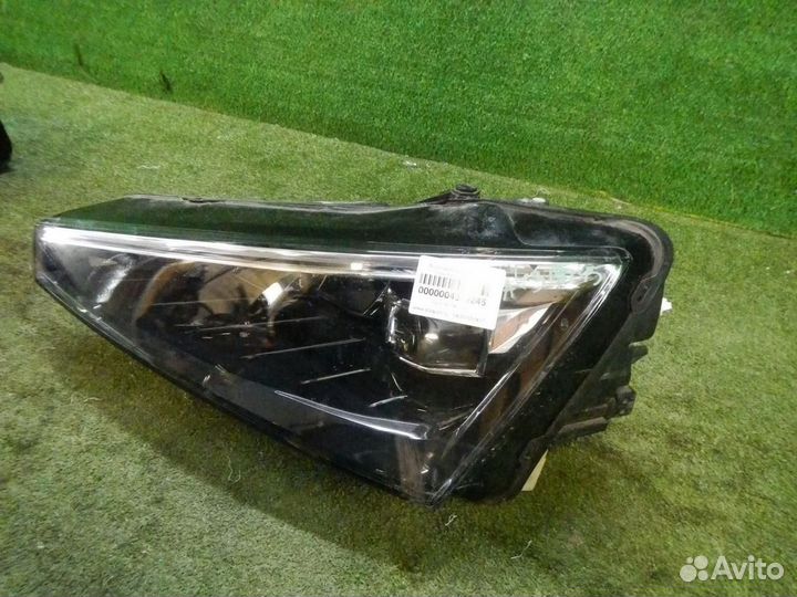 Фара левая Skoda Rapid