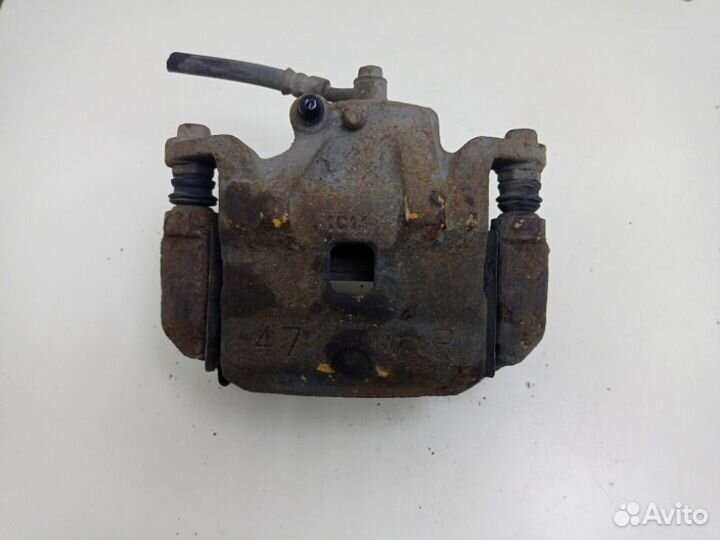 Суппорт тормозной передний правый Nissan Tiida