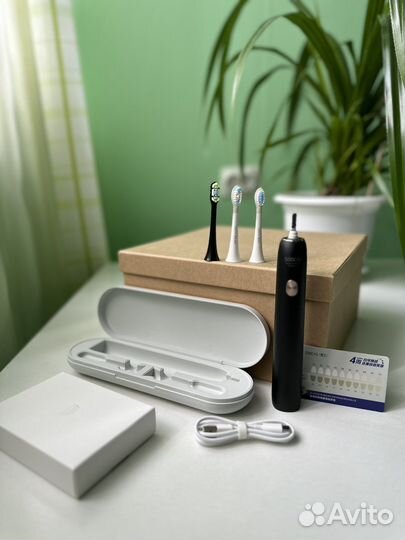 Электрическая зубная щетка