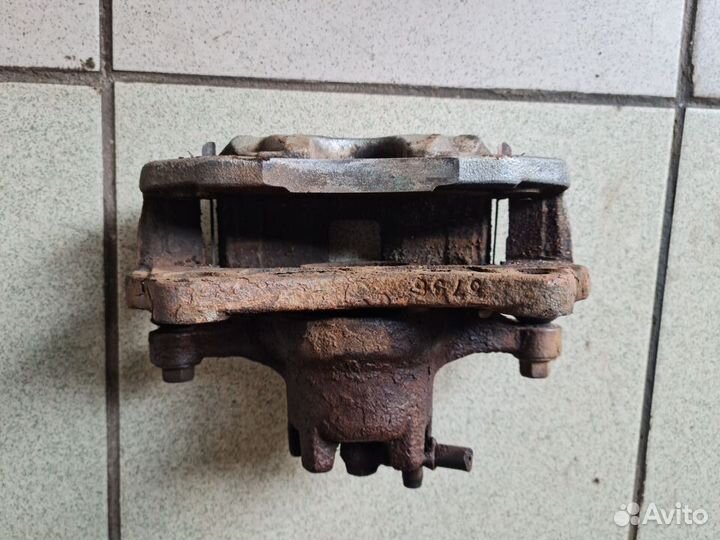 Суппорт передний задний Mitsubishi Lancer X