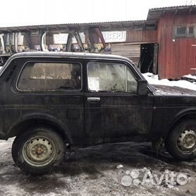 Задний силовой бампер РИФ с квадратом под фаркоп, калиткой под запаску и фонарями на ВАЗ Нива