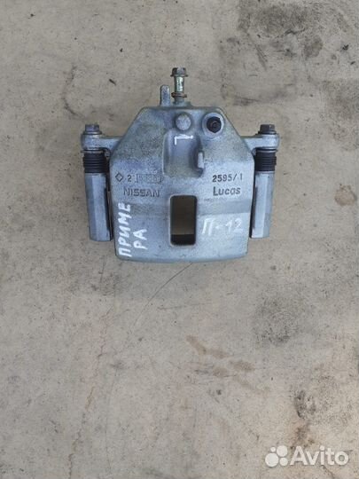 Суппорт тормозной передний Nissan Primera p12