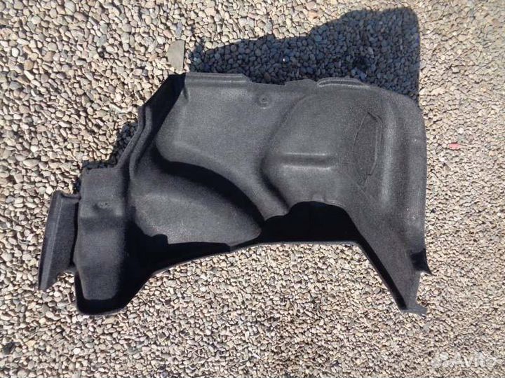 Обшивка багажника правая Toyota Corolla NZE124