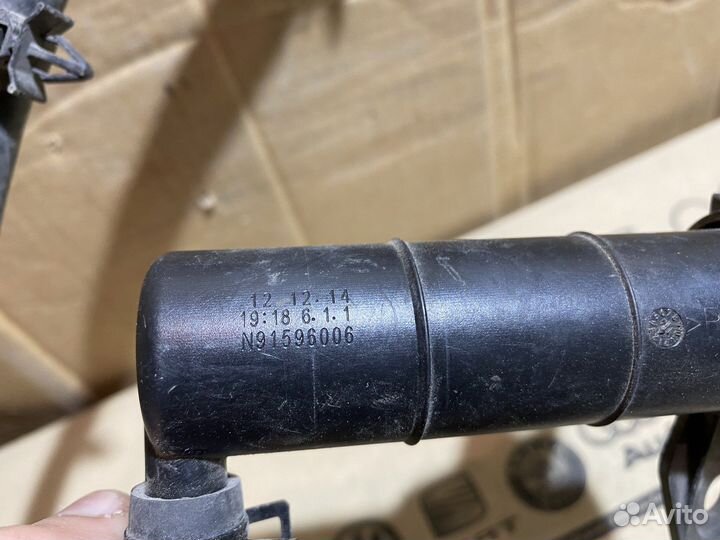 Форсунка омывателя фары правой KIA Sportage 3