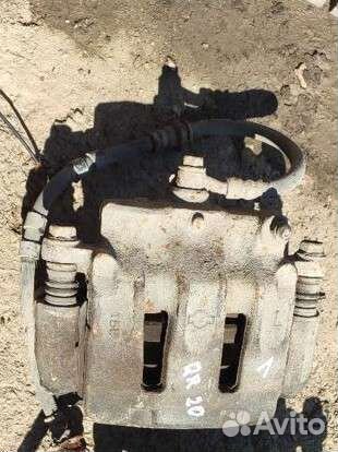 Левый тормозной суппорт Ниссан Либерти