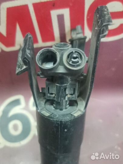 Форсунка омывателя фары Nissan Note