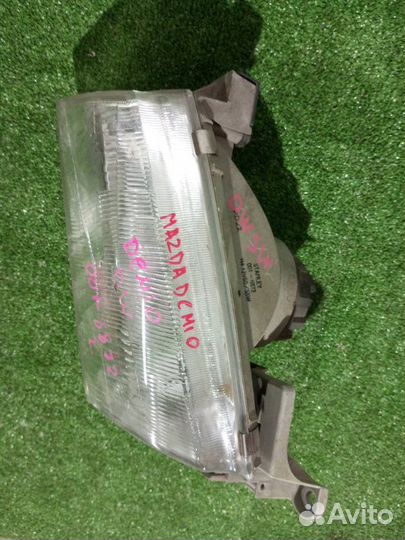 Фара галогеновая левая Mazda Demio