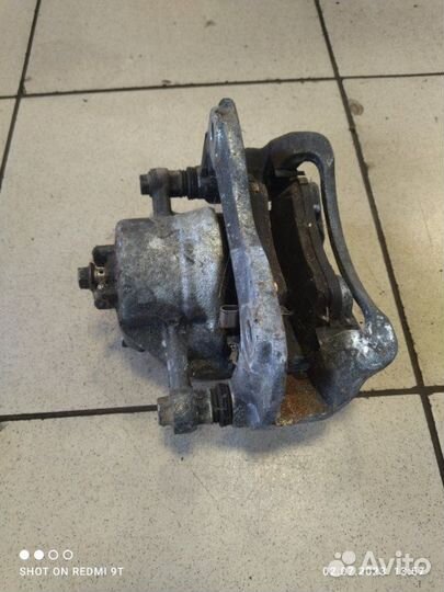 Суппорт тормозной передний левый Kia Rio 4