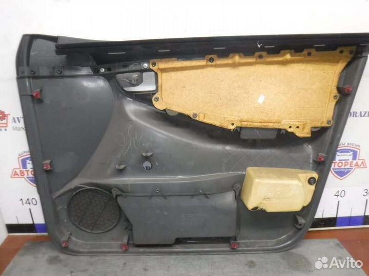 Обшивка двери передняя левая Toyota Corolla 124