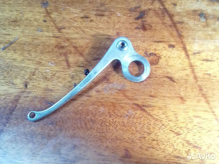 Нитеоттягиватель