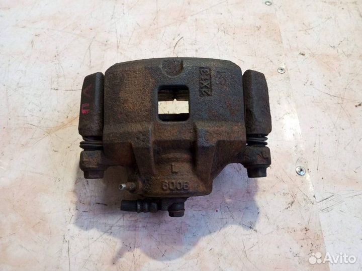 Суппорт тормозной передний левый Mitsubishi Galant