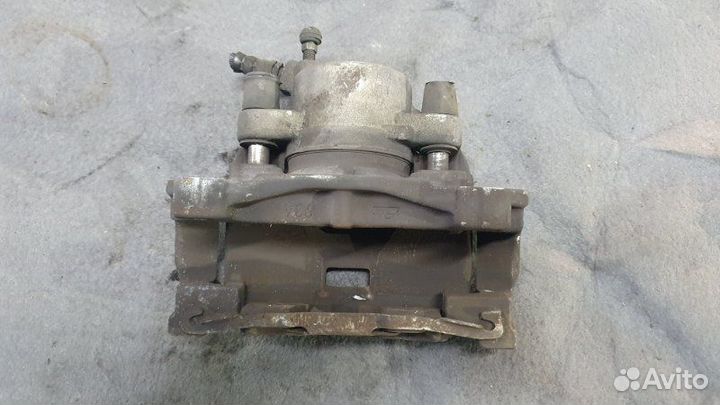 Суппорт тормозной передний левый Volvo S80 AS60