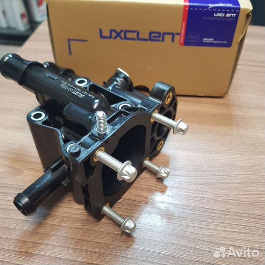 Пластиковый корпус термостата Opel Astra H