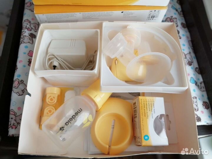 Молокоотсос medela электрический