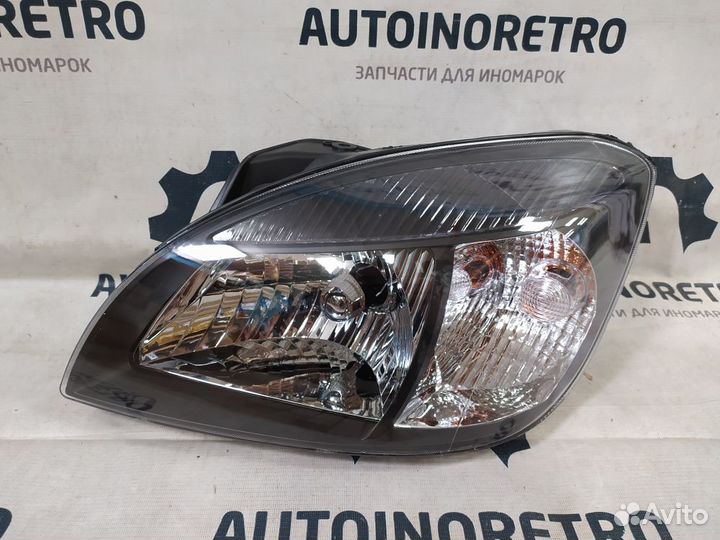 Фара левая (черная) Kia Rio II рест. (2009-2011)