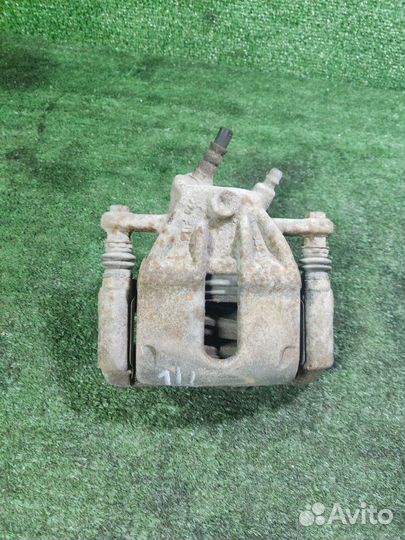 Суппорт тормозной передний левый Nissan Almera G15