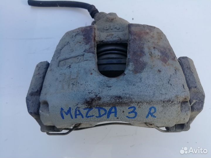 Суппорт передний правый Мазда 3